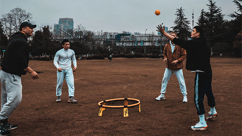 Consumers in China playing Spikeball